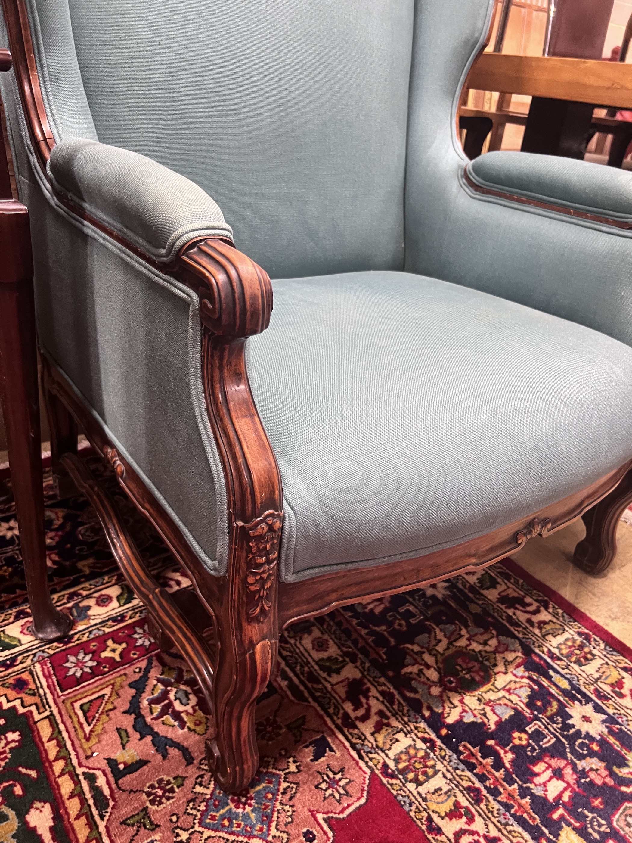 A large Louis XVI style upholstered wing armchair, width 80cm, depth 82cm, height 116cm